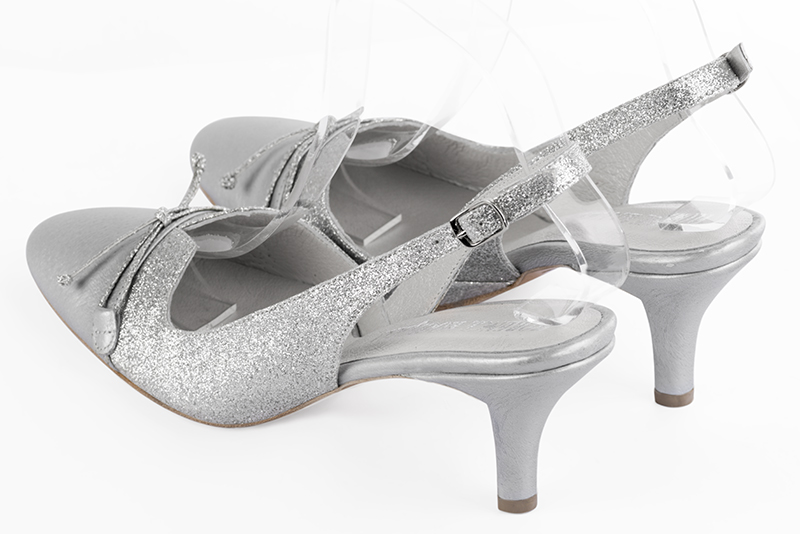 Light silver women's open back shoes, with a knot. Round toe. Medium slim heel. Rear view - Florence KOOIJMAN